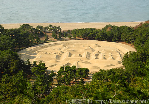 Ariake beach of coins sand art